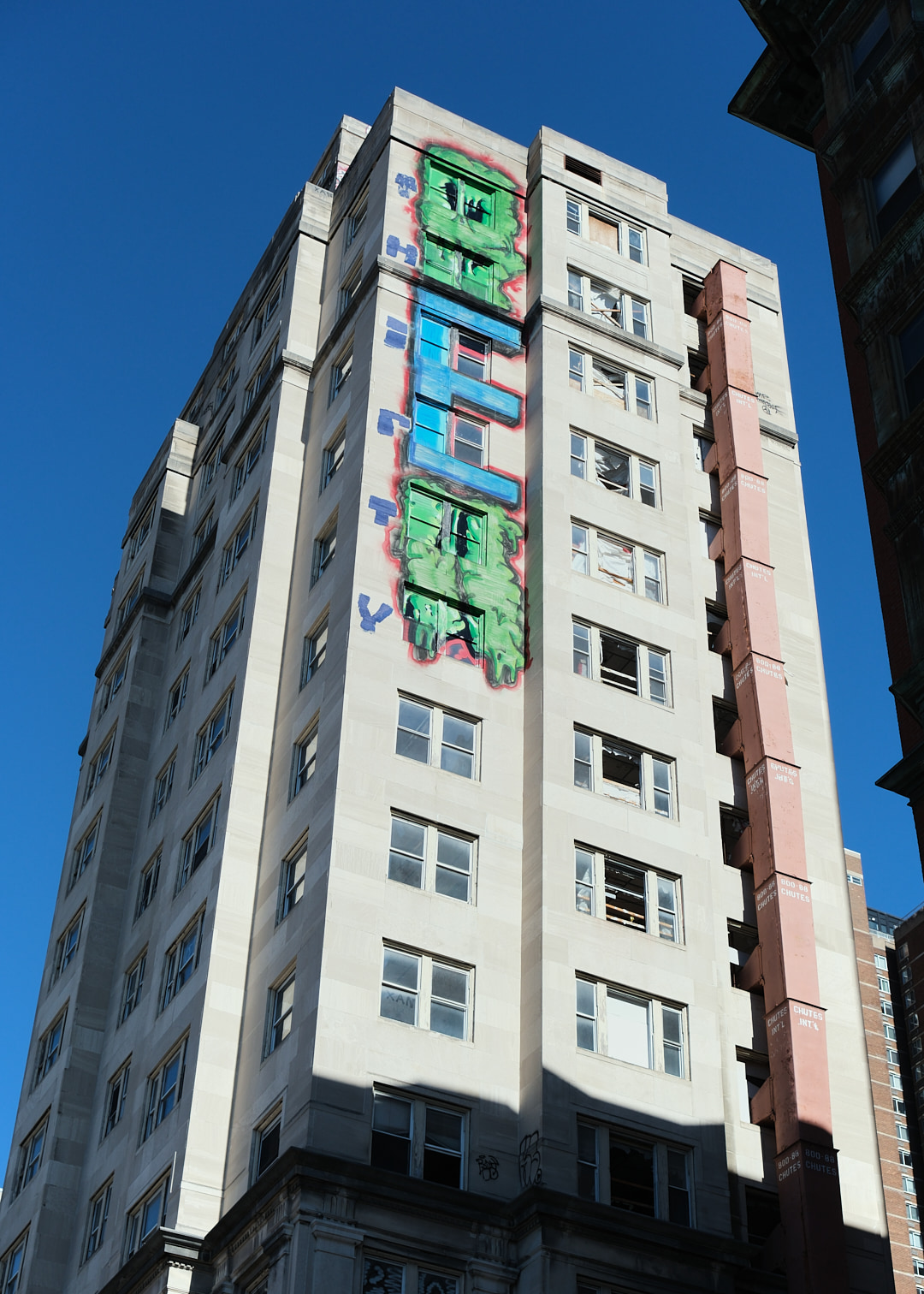 Giant graffiti on side of midrise city building