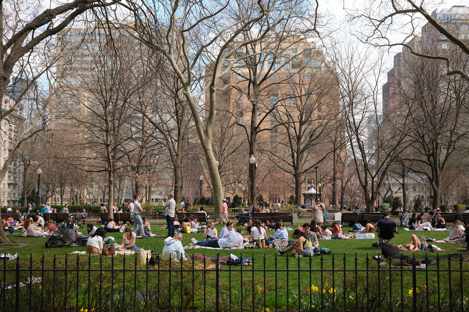 Many people enoying the spring weather in Rittenhouse Square, Philadelphia.
