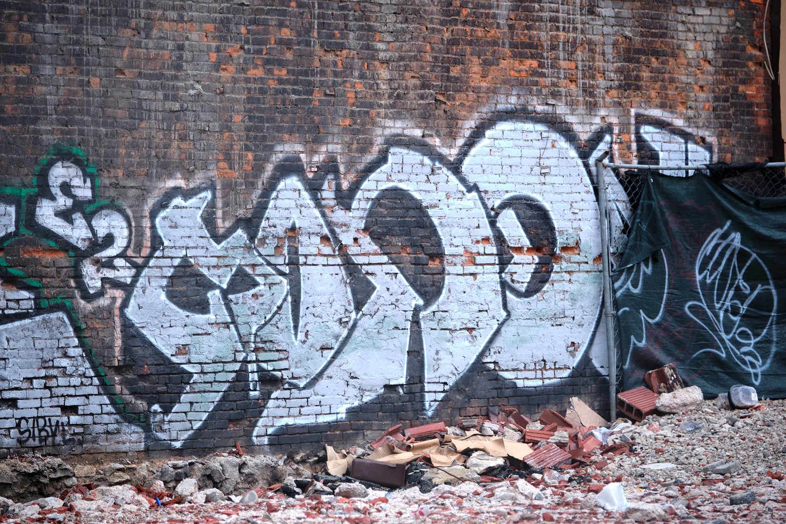 Large graffiti piece on brickwall.