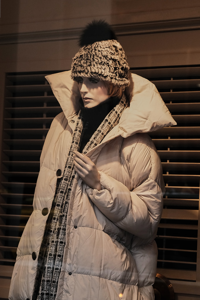Well-dressed mannequin in shop window